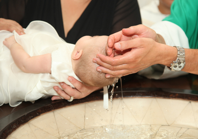 Priest Baptizing a Baby